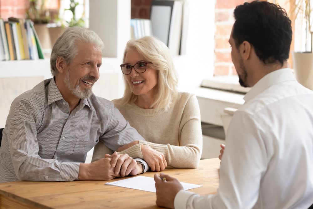 Elderly spouses at a meeting with a banker