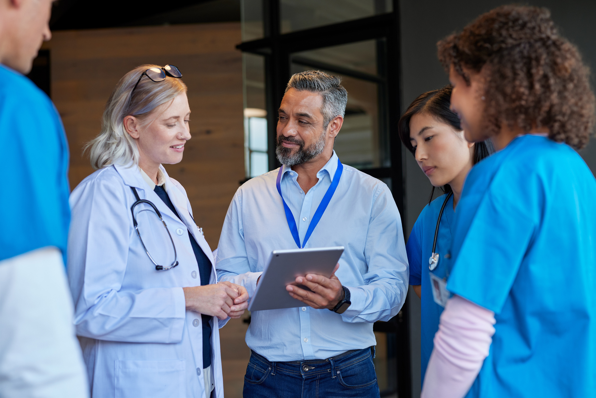 multiethnic_healthcare_team_meeting_pharmaceutical_representative